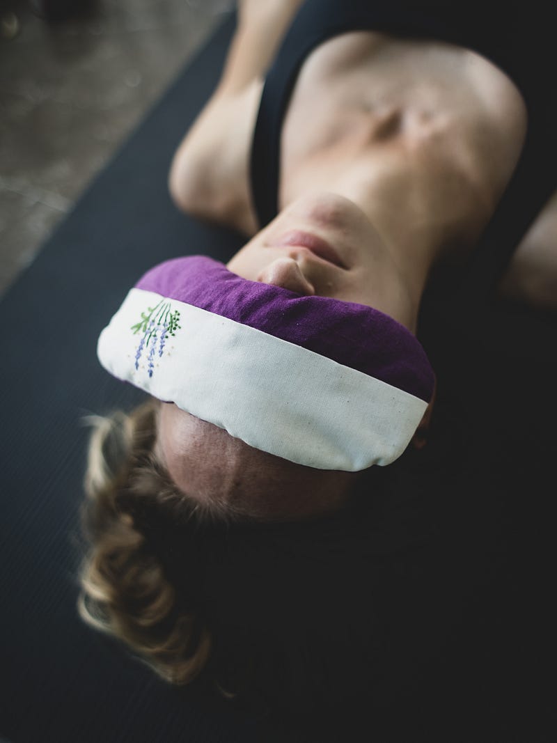 Person practicing yoga in a heated studio